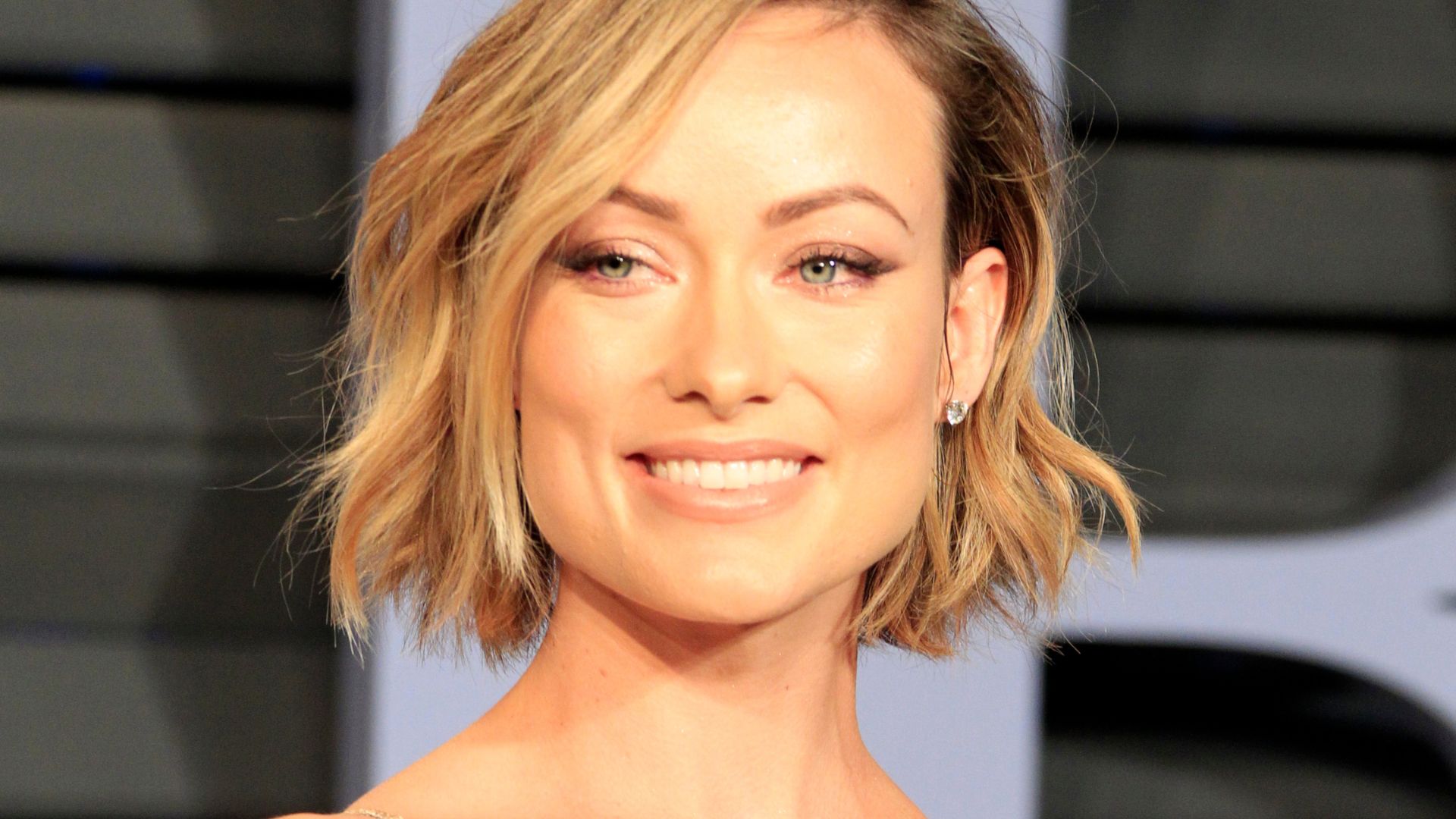 Olivia Wilde Turns Heads in Barely-There Dress at Oscars After Party [WATCH]